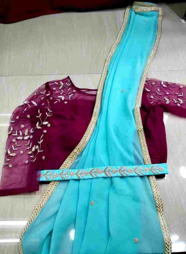 Sky Saree and Magenta Belt with Hand work Blouse