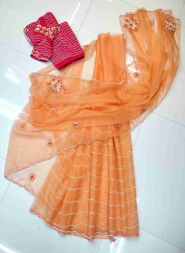 Peach pearl and sequins embroidered saree and hot pink blouse