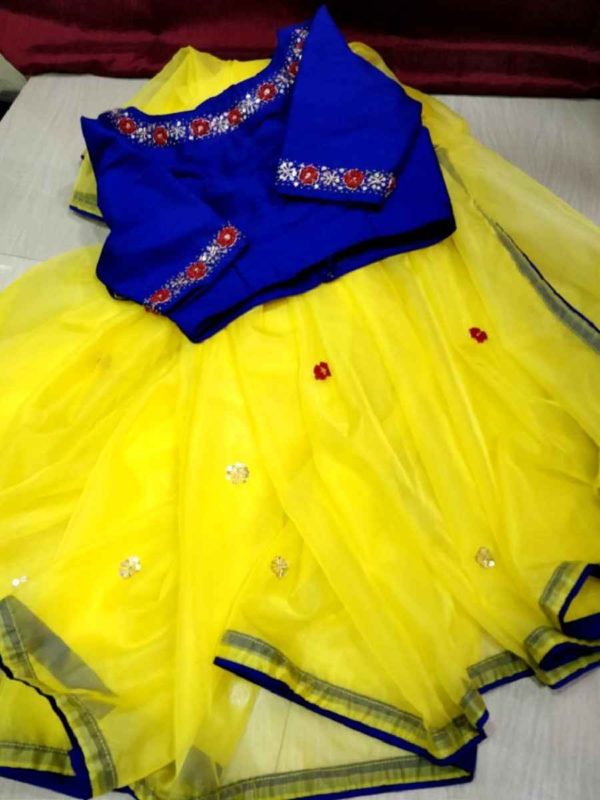 Yellow organza saree and blue hand work Blouse